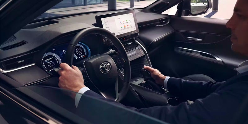 A man drives a Toyota Venza