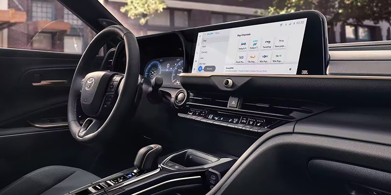Interior view of steering column and touch screen display.