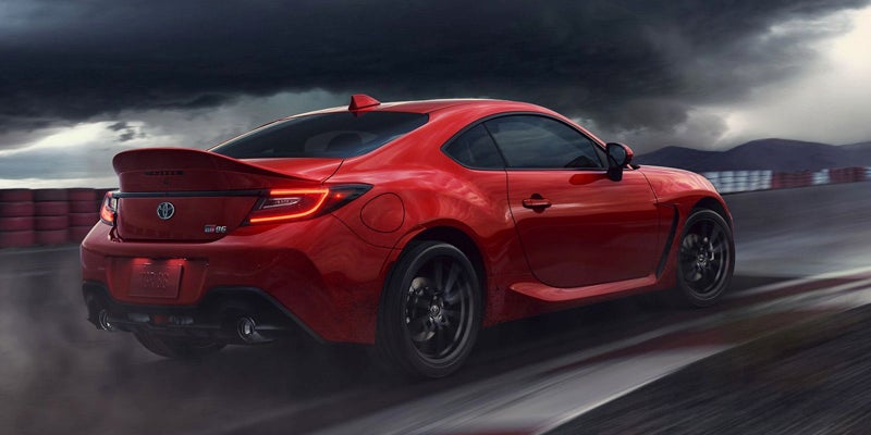 A Toyota GR86 driving around a racetrack