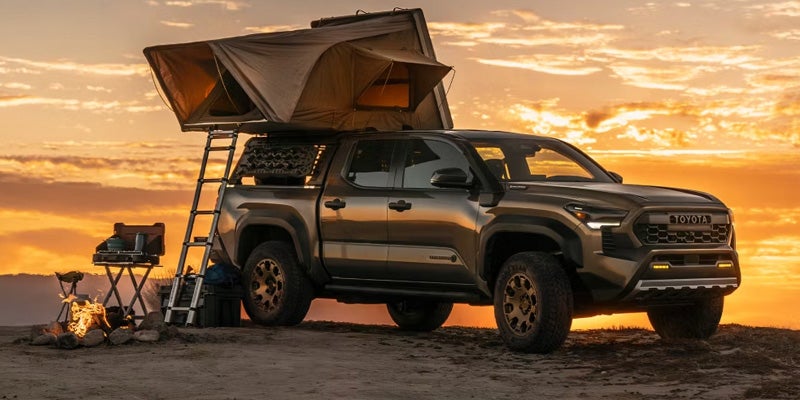 a 2025 Toyota Tacoma parked at a camp site