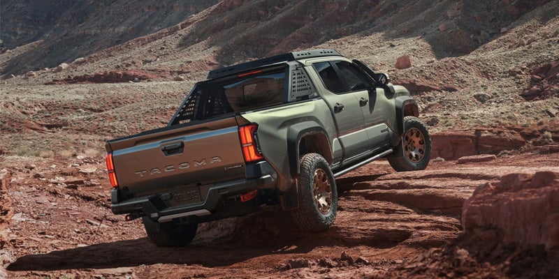 a 2025 Toyota Tacoma off roading going up a hill